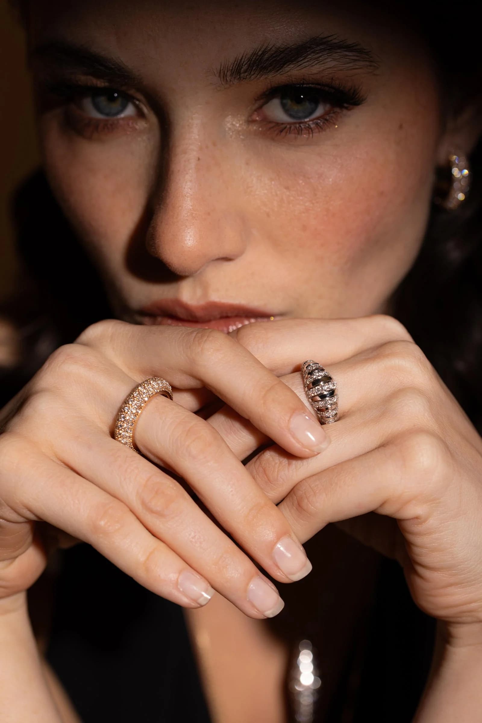 Dina J campaign portrait highlighting diamond rings