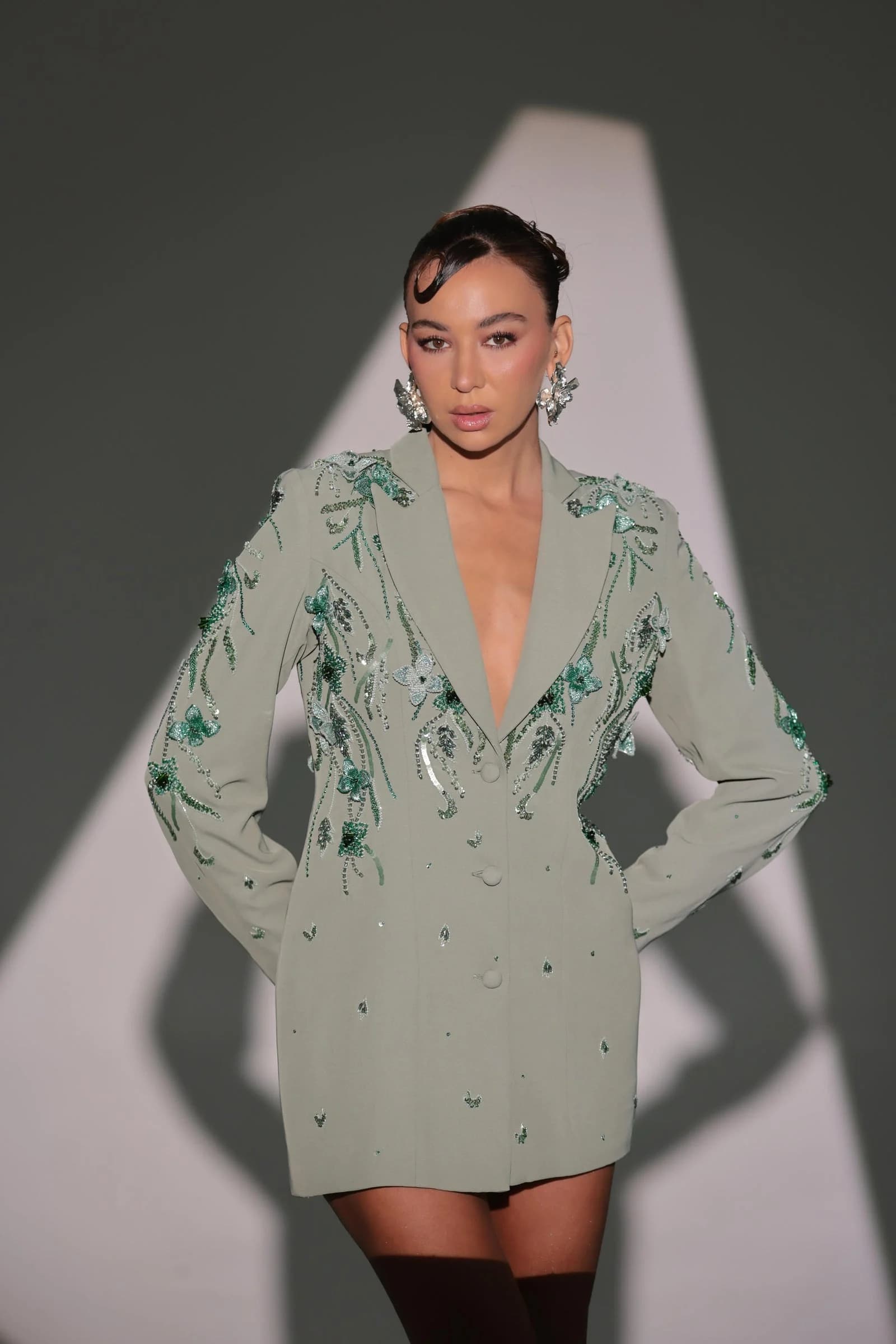 Li Luce campaign model wearing an embroidered mint tailored jacket