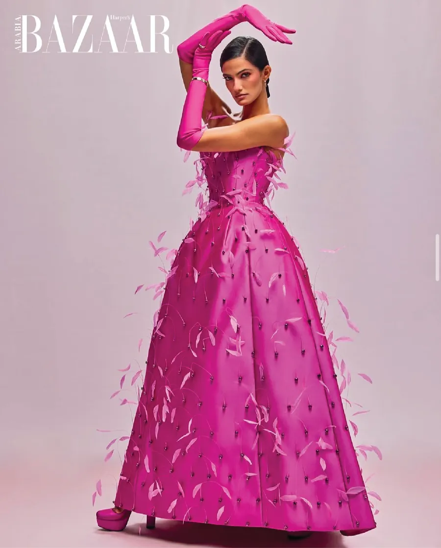 Harper's Bazaar Arabia cover with a model in a fuchsia feathered ball gown