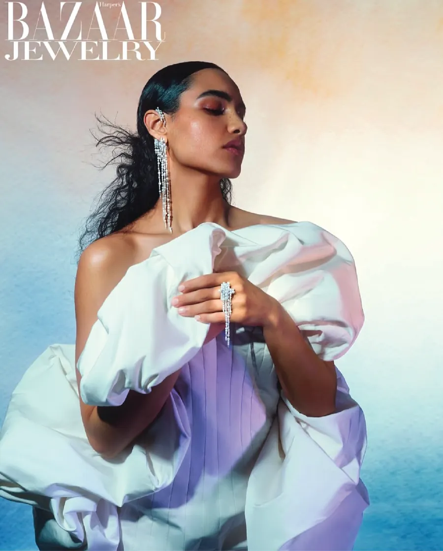Harper's Bazaar Jewelry cover with a model in a sculptural white gown and diamond earrings