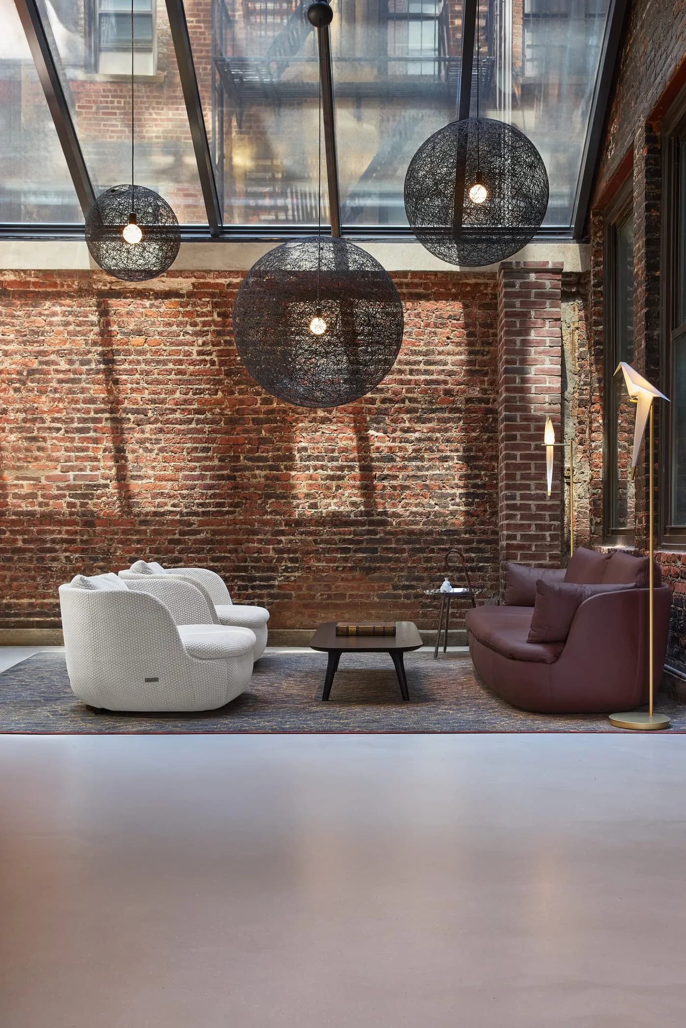 Moooi furniture and sculptural pendant lighting in its New York showroom