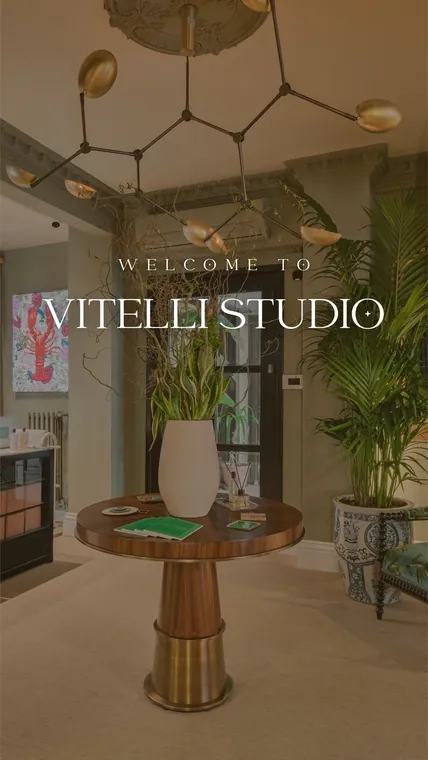 The Vitelli Studio showroom with a brass chandelier