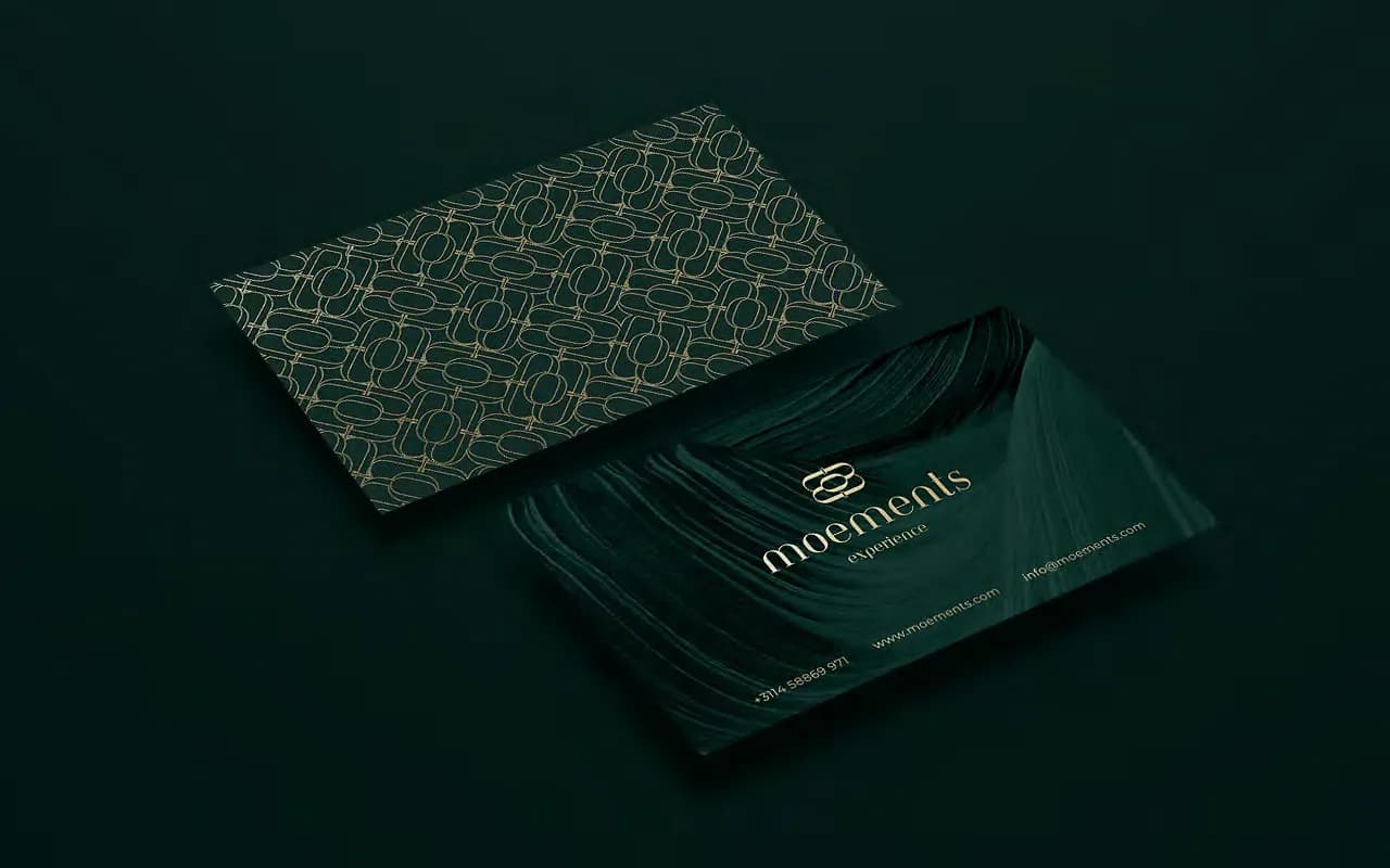 Moements business card option 2: gold foil brand pattern with a deep green wave back