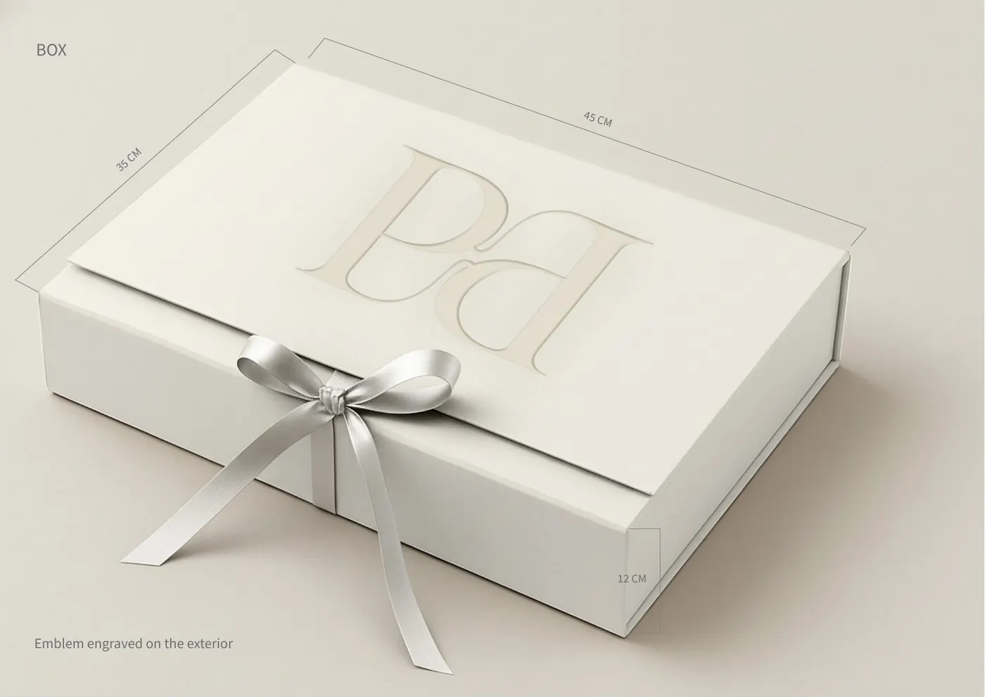 Pearelle gift box with the embossed emblem and a satin ribbon