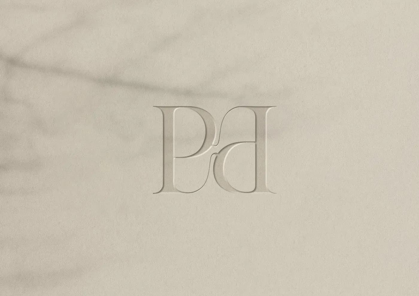 The Pearelle Pd emblem, embossed on paper