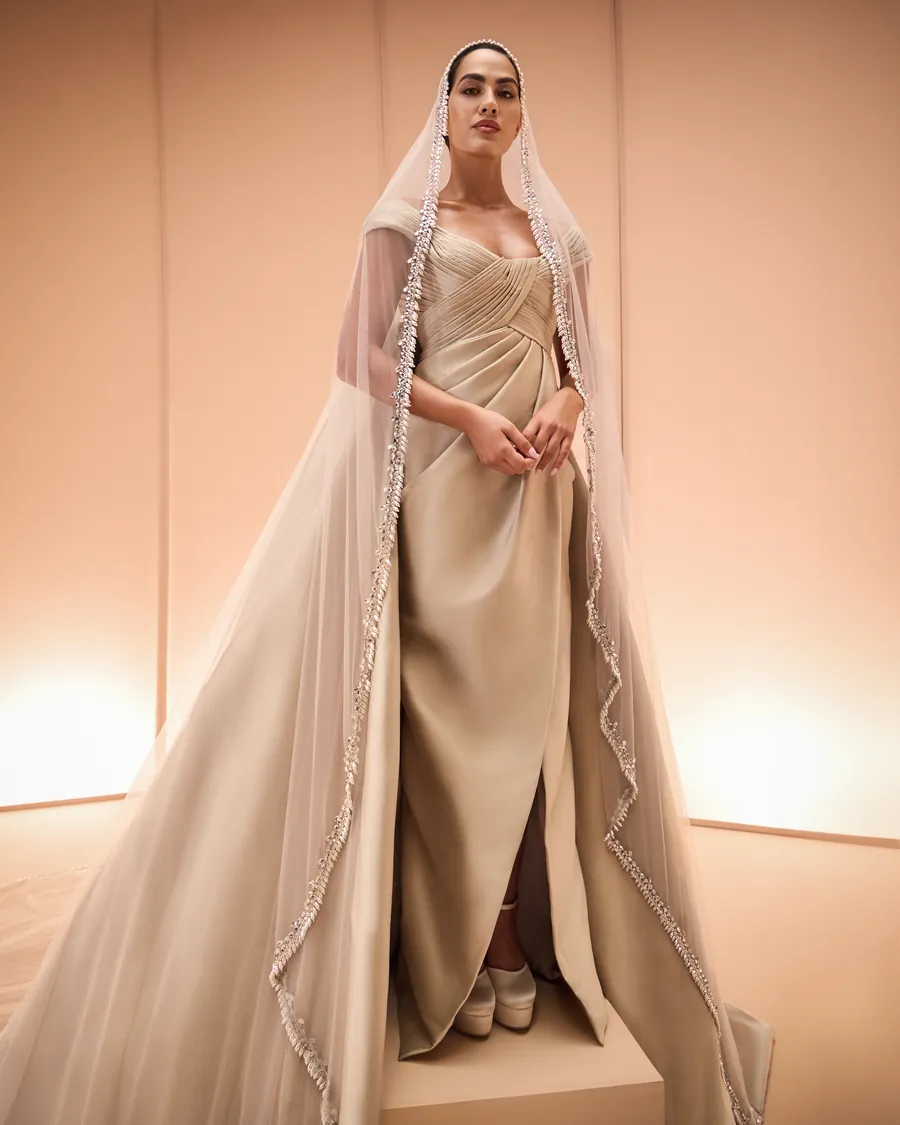 Elio Abou Fayssal: a draped satin gown with a crystal-edged veil