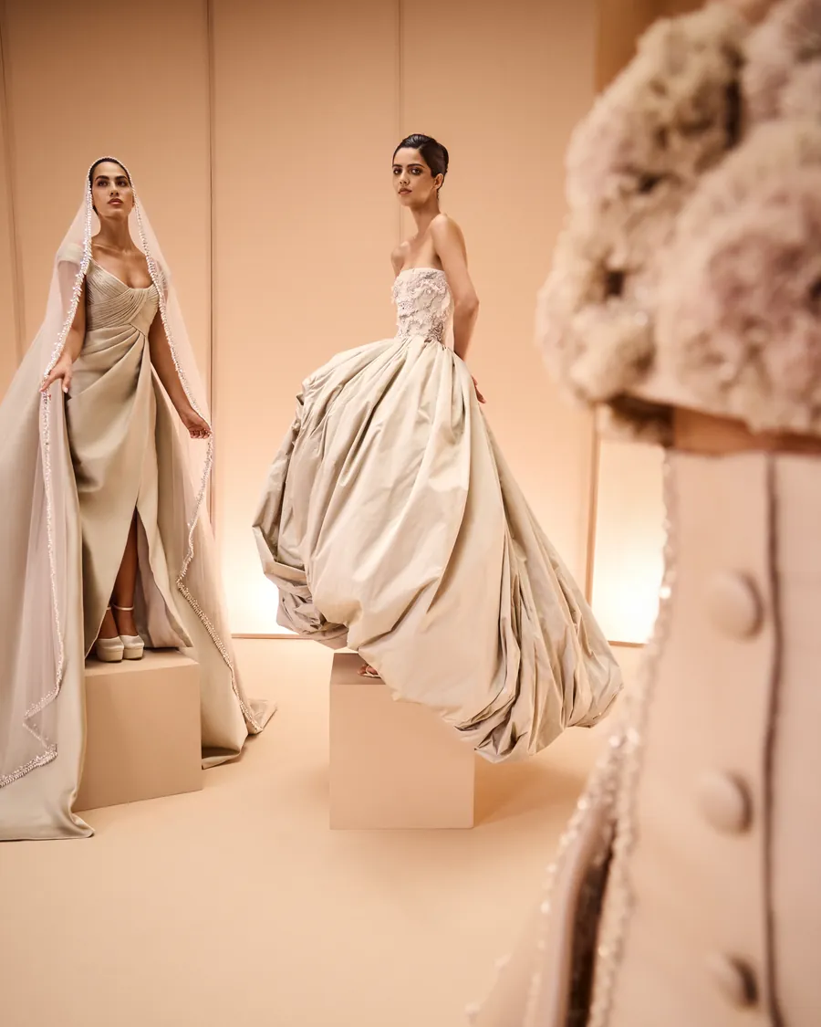 Elio Abou Fayssal: a veiled gown beside a sculpted ball gown